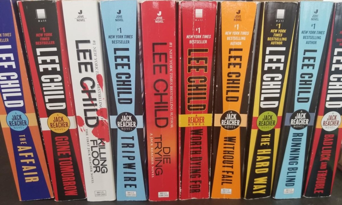 A row of Lee Child's Jack Reacher paperbacks on a shelf, including Killing Floor, Die Trying, Tripwire, and The Affair.