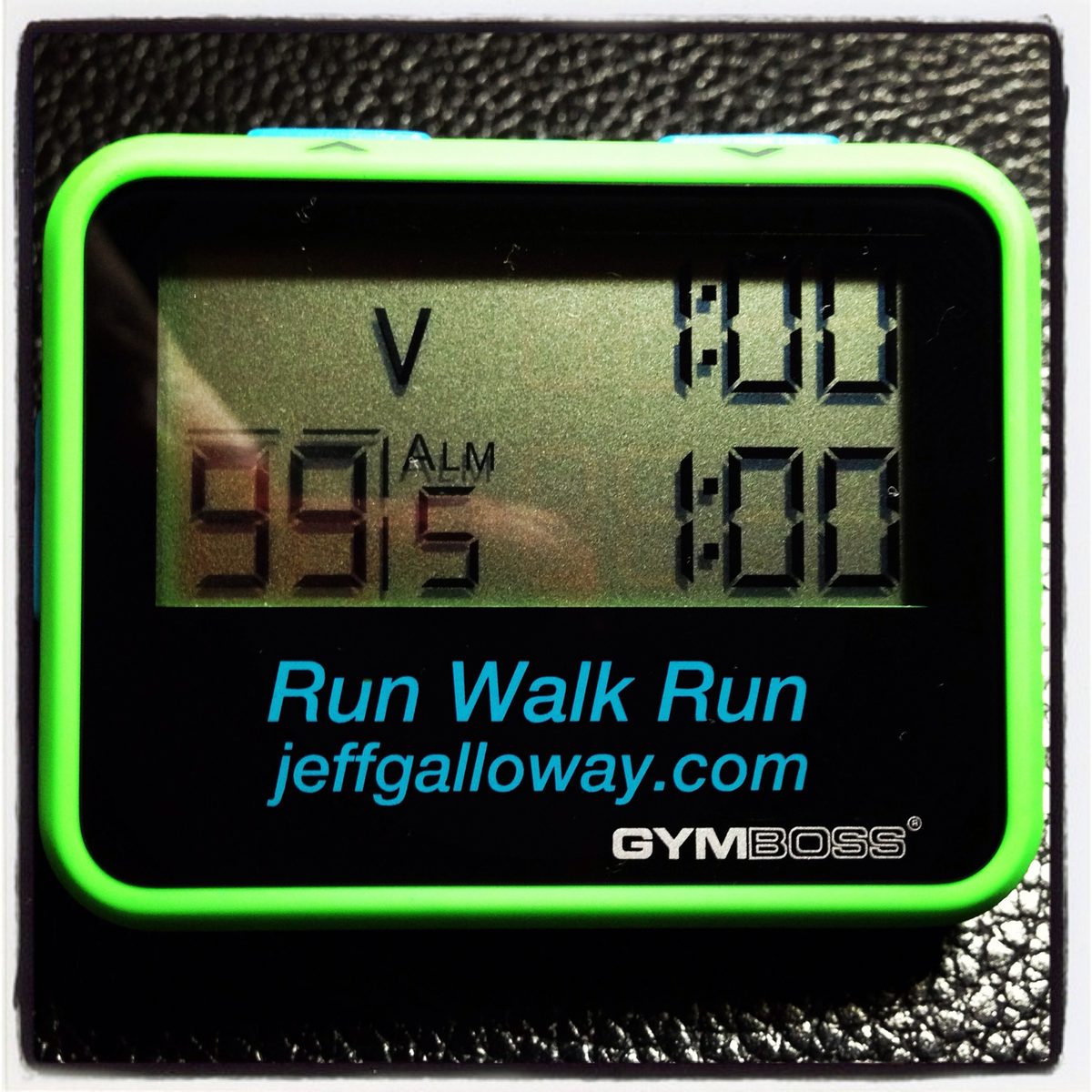 A green Gymboss interval timer reading 1:00 and 1:00, printed with Run Walk Run and jeffgalloway.com.